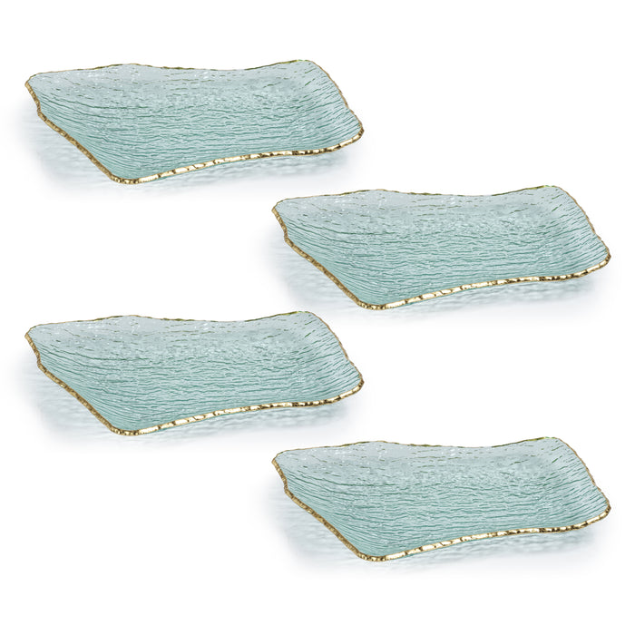 A set of four rectangular glass plates with a jagged gold rim on a textured blue background.