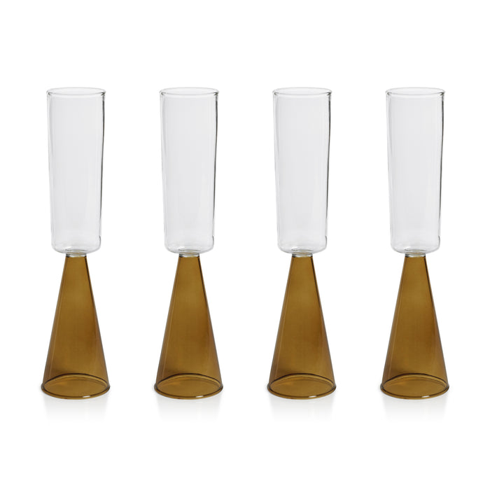 Four glass candle holders with brown bases on a white background