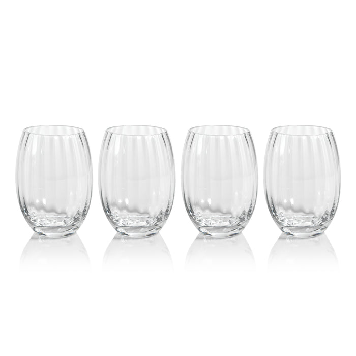 Set of four clear glass tumblers on a white background