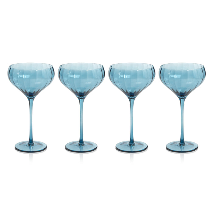 A set of four blue azure colored cocktail glasses with a streamlined design, placed side by side against a white background.