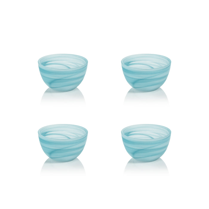 Four light blue glass bowls with wavy design on a white background