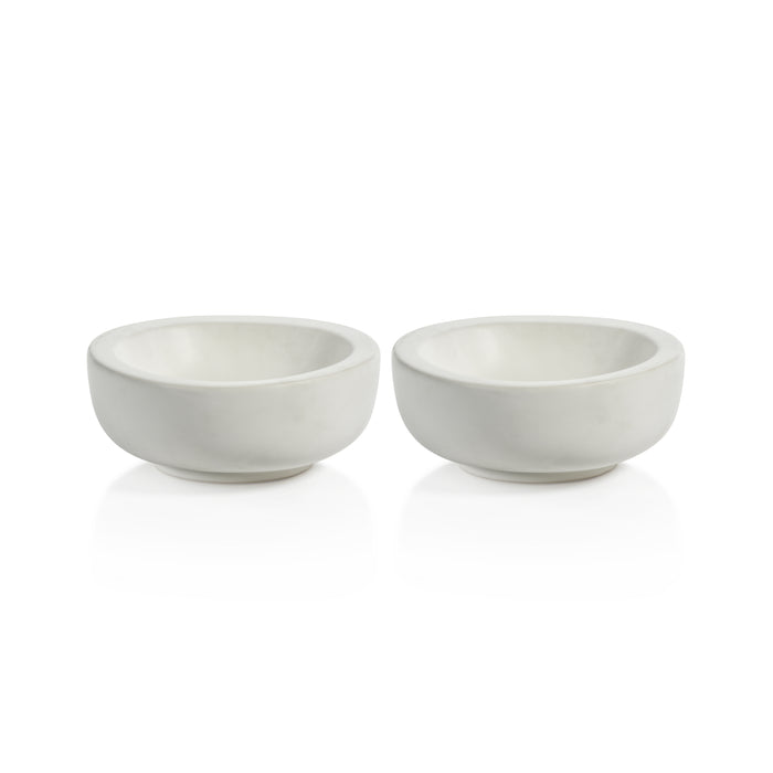 Two white ceramic bowls on a white background