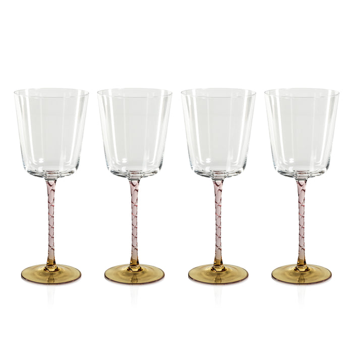 A set of four red wine glasses with amber and pink colored stems, otherwise clear.