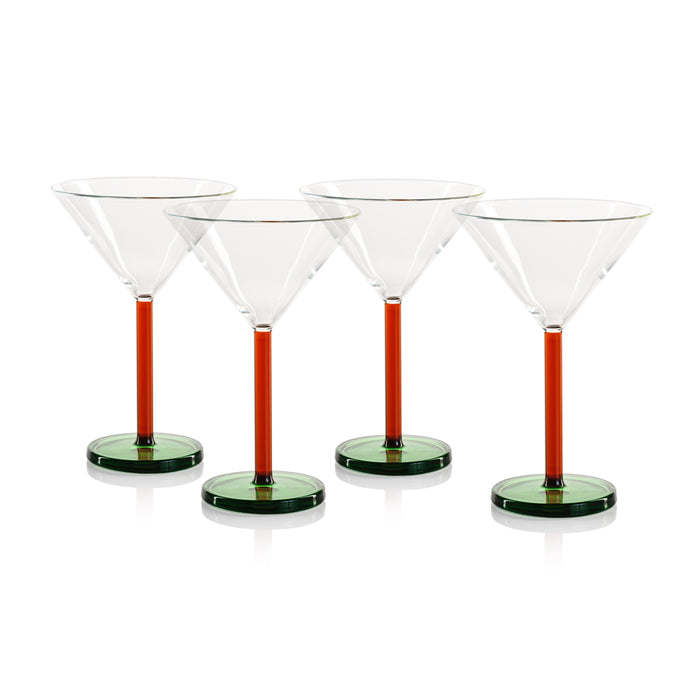 Four martini glasses with colored stems on a white background