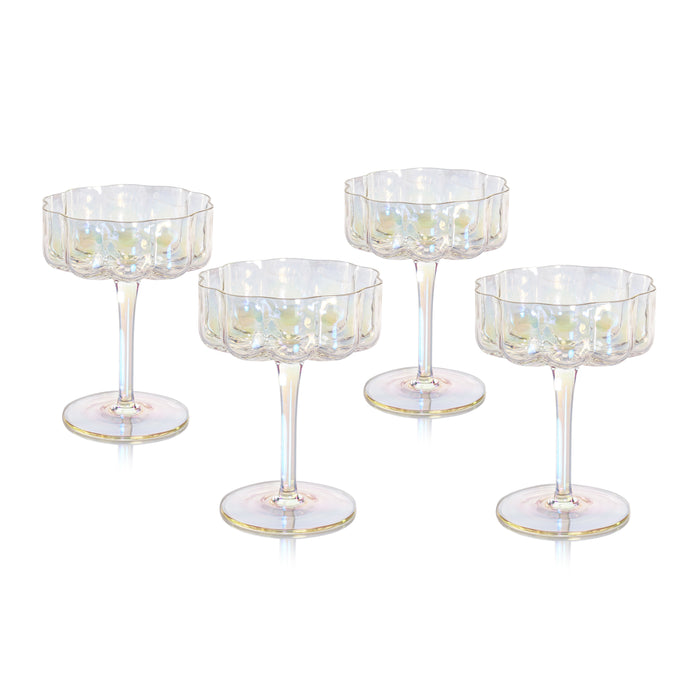 Set of four decorative cocktail glasses with gold accents on a white background