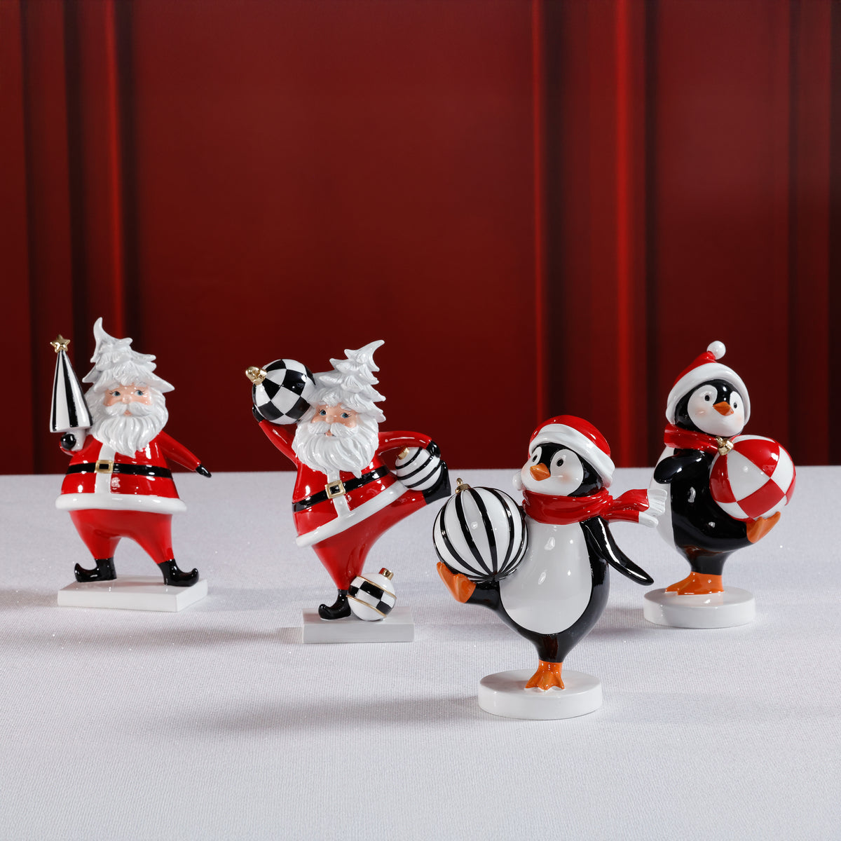 Zodax Festive Four Santa & Penguin Figurines, Set of 4, Holiday Decoration, 7" Tall