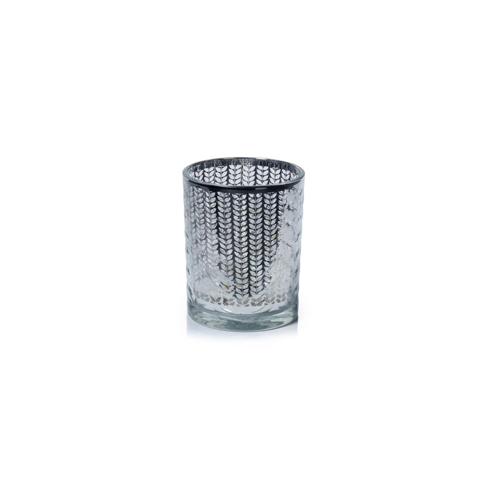 Clear glass tumbler with textured pattern on a white background