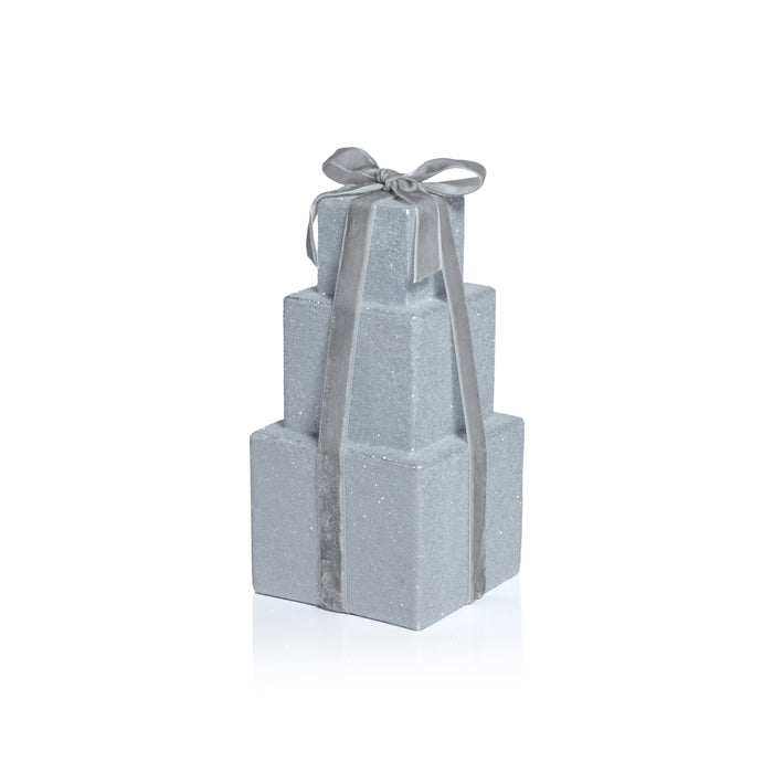 Stack of gray gift boxes with a ribbon on a white background