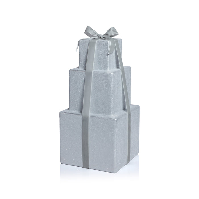 Stack of gray gift boxes with a ribbon on a white background