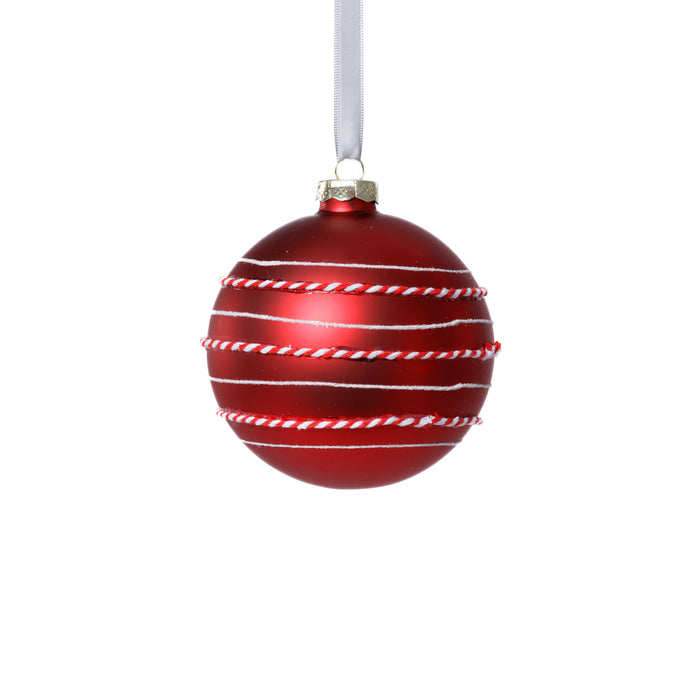 Red Christmas ornament with white stripes on a white background