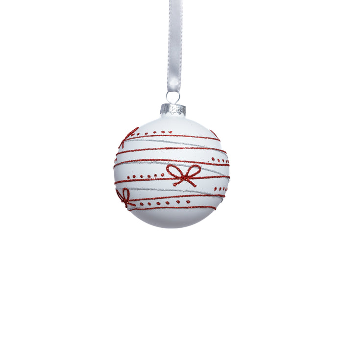 White Christmas ornament with red ribbons and bows on a white background