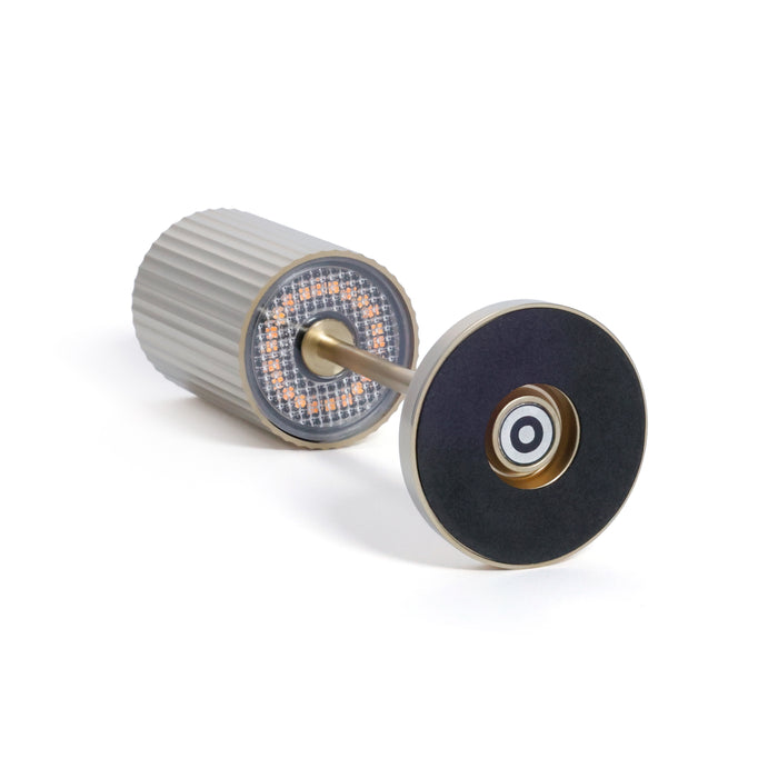 Two cylindrical objects with intricate designs on a white background