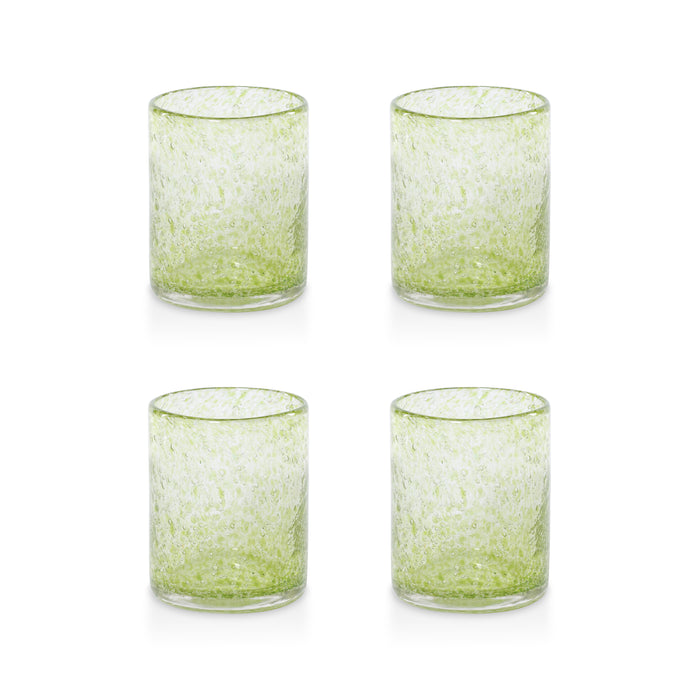 Four green glass tumblers with a speckled pattern on a white background