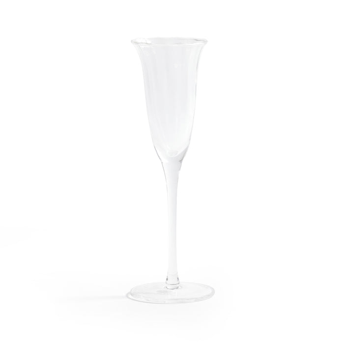 Clear champagne flute on a white background