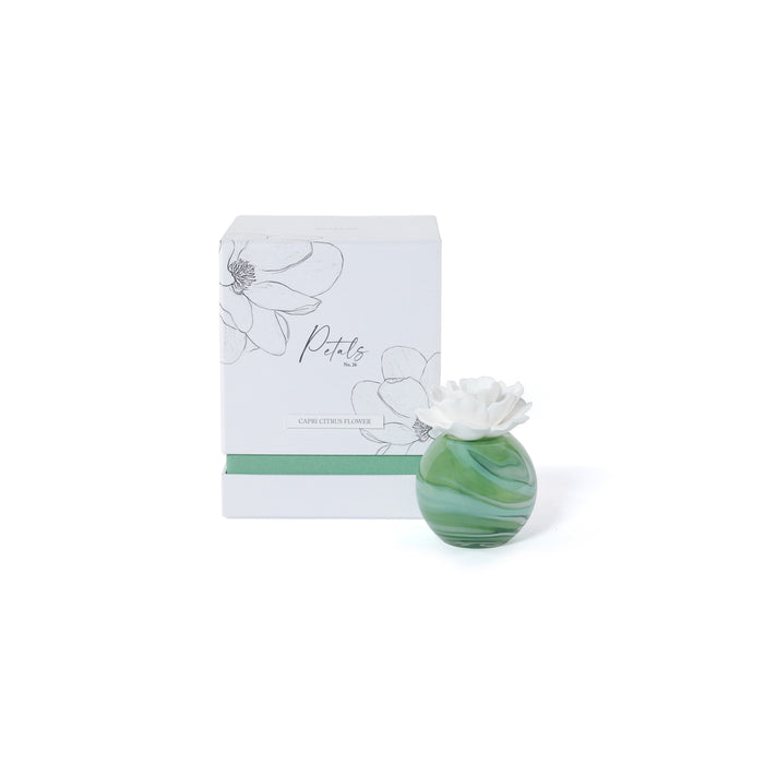 Green marbled vase with white flower and matching box on a white background