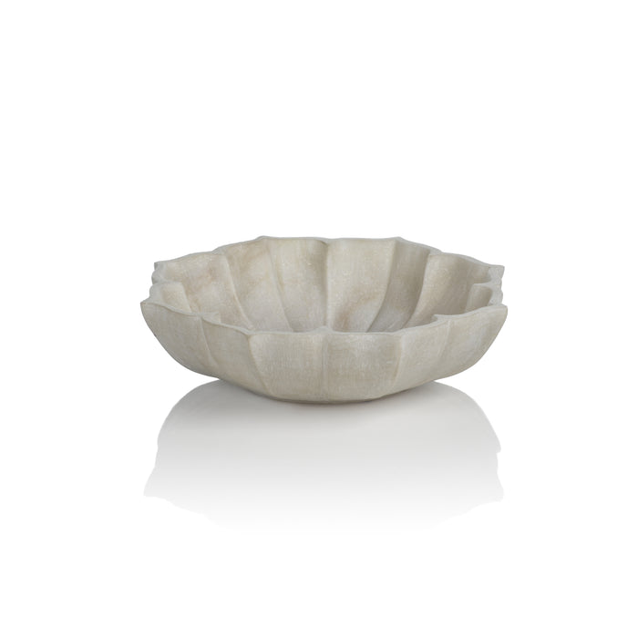 An off-white marble decorative bowl with a lotus shape design, displayed against a neutral background.