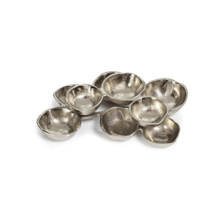 Set of small silver bowls on a white background
