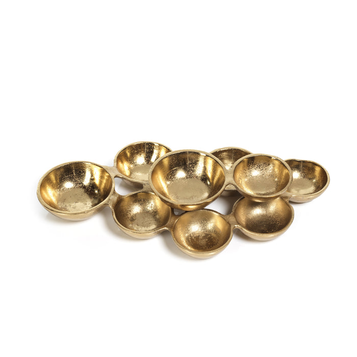 Set of gold bowls on a white background