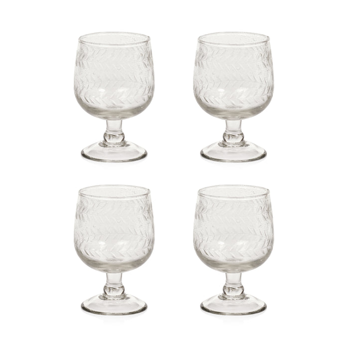 A set of four clear glass white wine glasses with an etched leaf pattern.