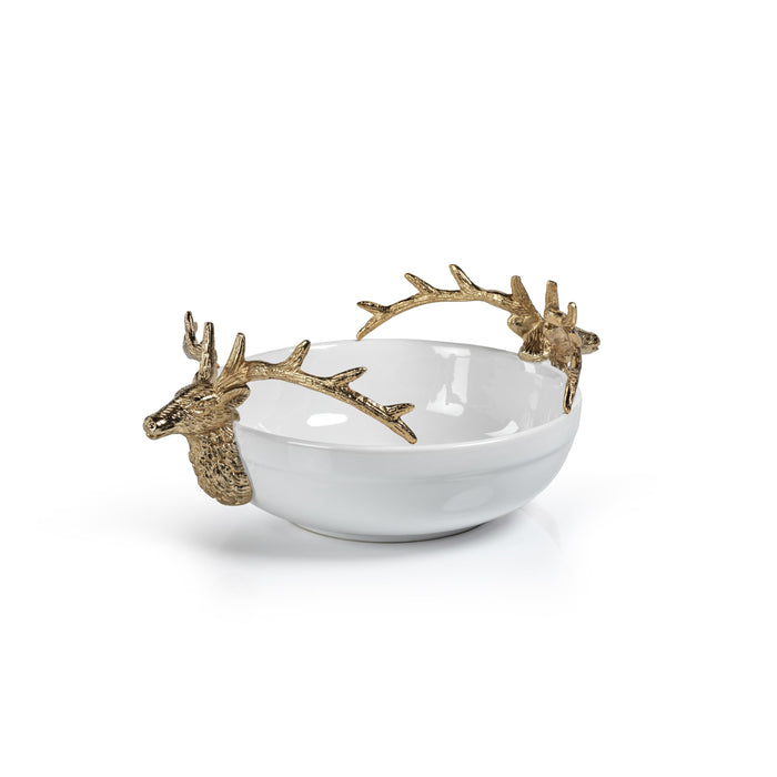 A white ceramic bowl with gold deer head handles on each side.