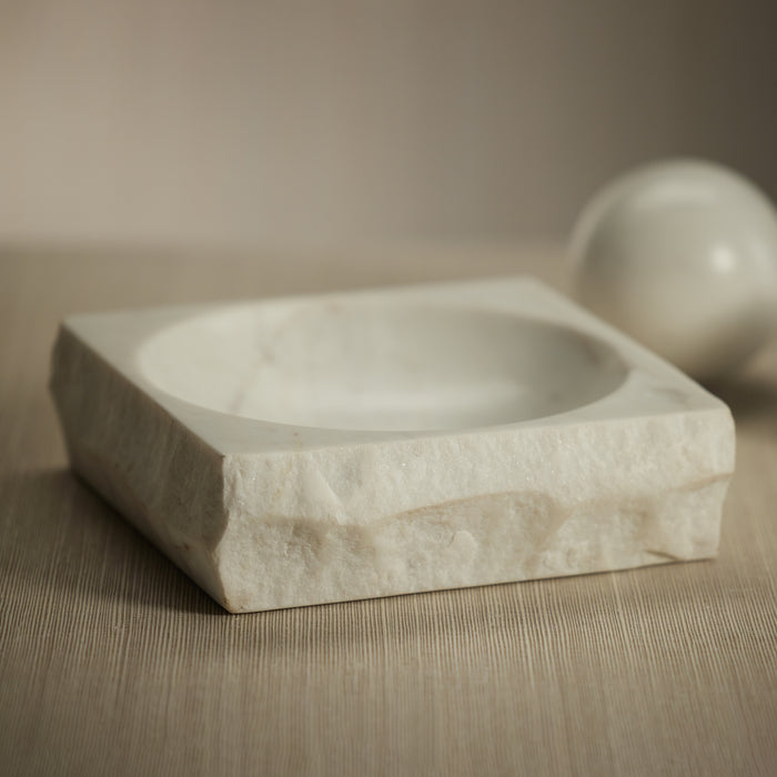 Marble soap dish on a wooden surface with a neutral background