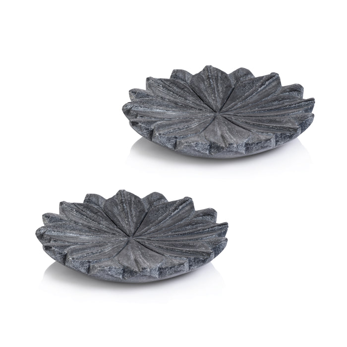 Two gray marble decorative dishes shaped like lotus flowers against a white background.