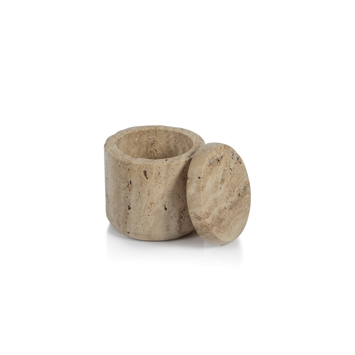 A beige travertine marble lidded canister on a white background.