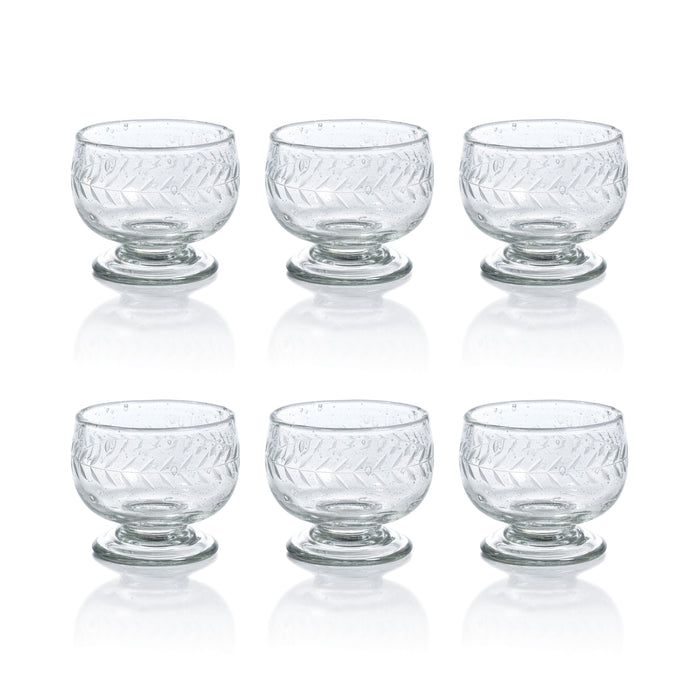Set of six clear glass dessert bowls with textured design on a white background