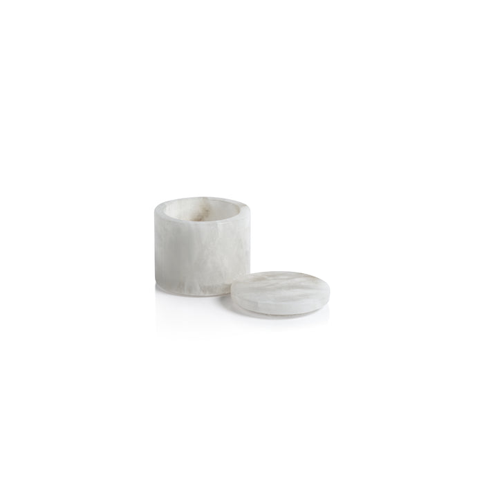 Marble-textured candle holder with lid on a white background