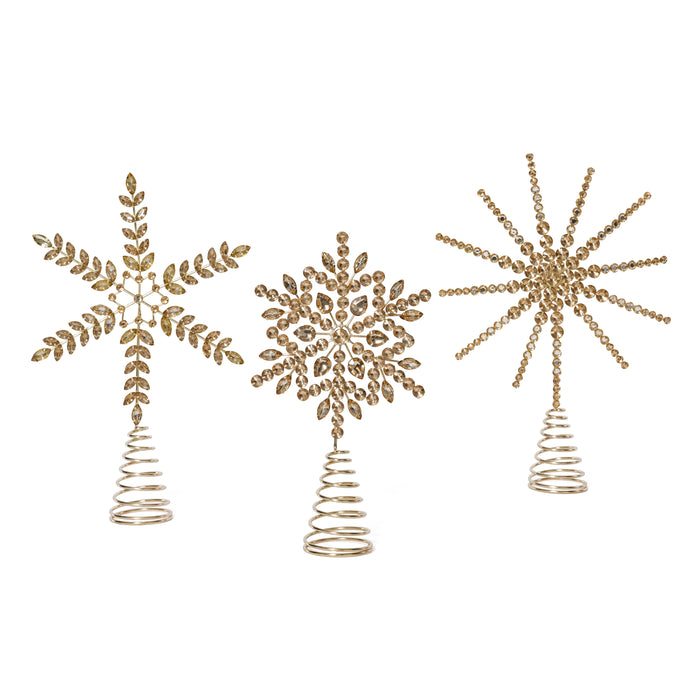 Three decorative tree toppers with leaf, snowflake, and starburst designs on a white background.