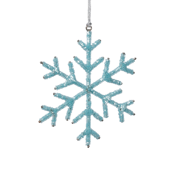 Blue snowflake ornament on a white background