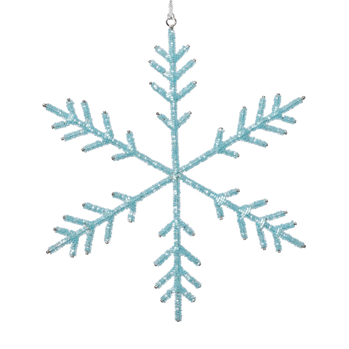 Blue snowflake ornament on a white background
