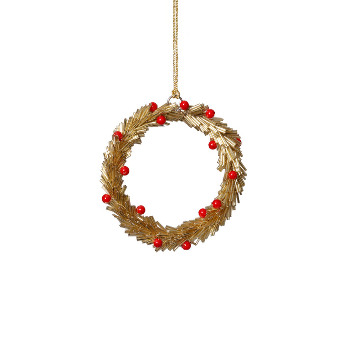 Decorative wreath ornament with red berries on a white background