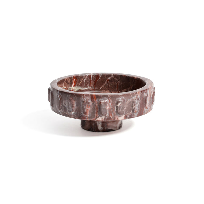 Black ring with a central gemstone on a white background