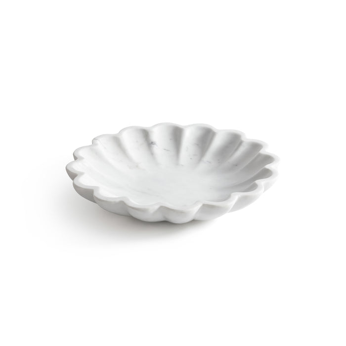 White scalloped-edge bowl on a white background
