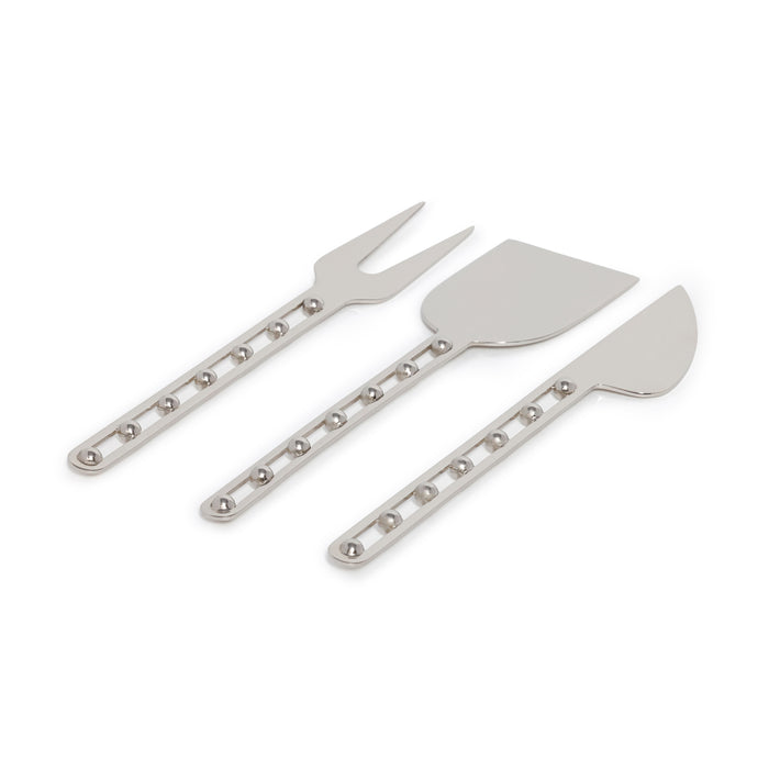Set of three metal cheese tools on a white background
