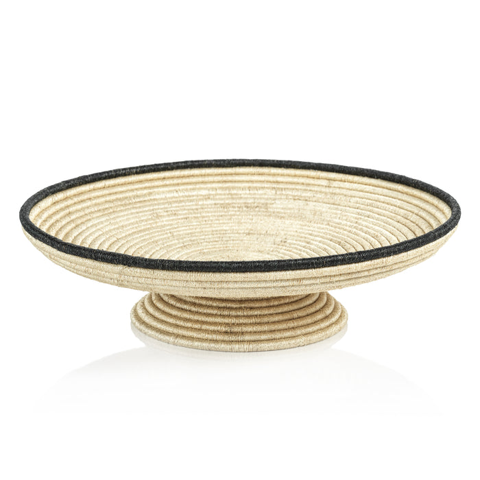 Decorative bowl with woven design on a white background
