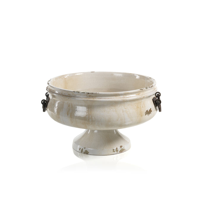 Decorative pedestal bowl with metallic accents on a white background