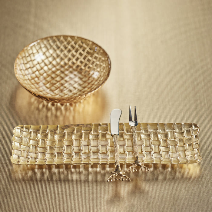 Woven glass tray with knife and fork on a beige background