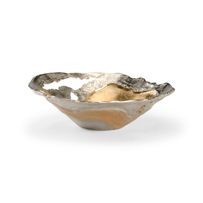 Decorative bowl with gold and silver finish on a white background