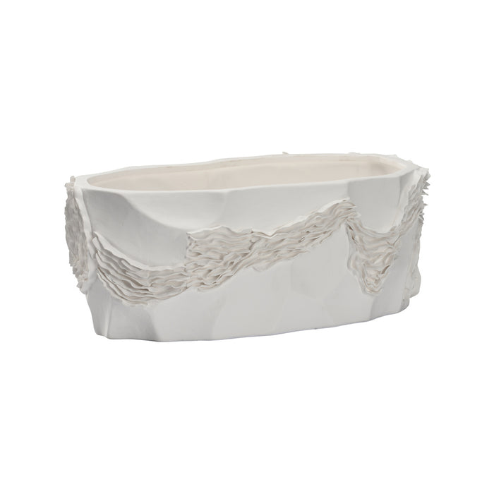 White ceramic planter with textured design on a white background