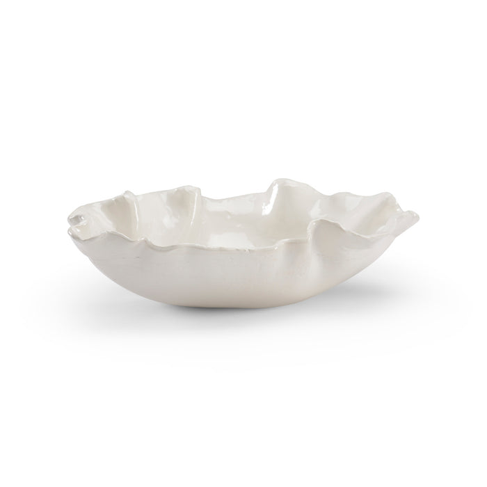 White ceramic bowl with ruffled edge on a white background