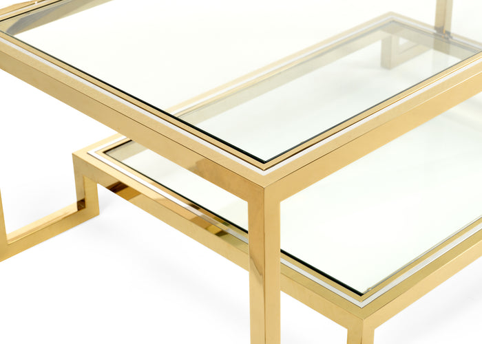 Gold-framed glass coffee table on a white background