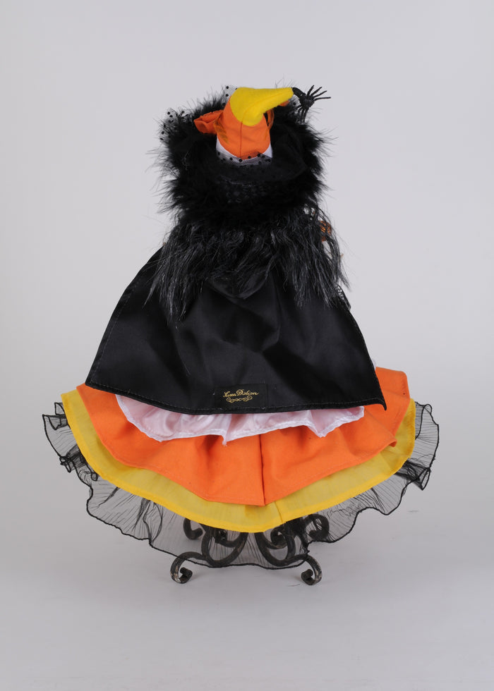 Dog costume shaped like a candy corn with black, orange, and yellow colors on a white background.