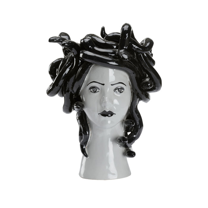 Decorative vase shaped like a woman's head with black hair on a white background