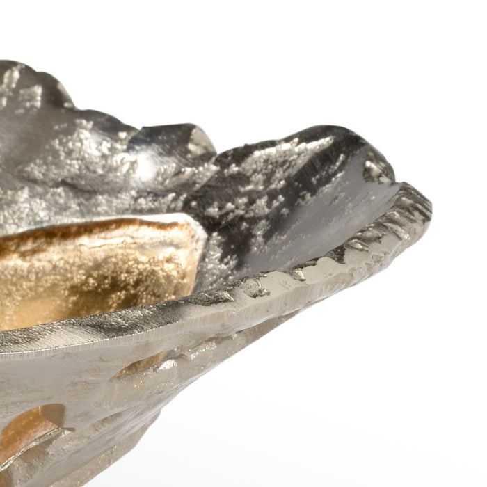 Close-up of a metal cutting tool bit on a white background