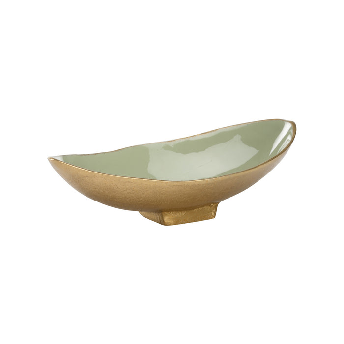 Two-tone ceramic bowl with green interior and beige exterior on a white background