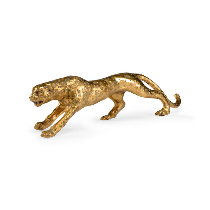 Gold panther figurine on a white background