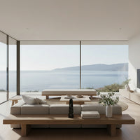 Black marble obelisk object on a long wood mid-century modern table inisde of a living room overlooking the ocean and mountain in Laguna Beach, California.