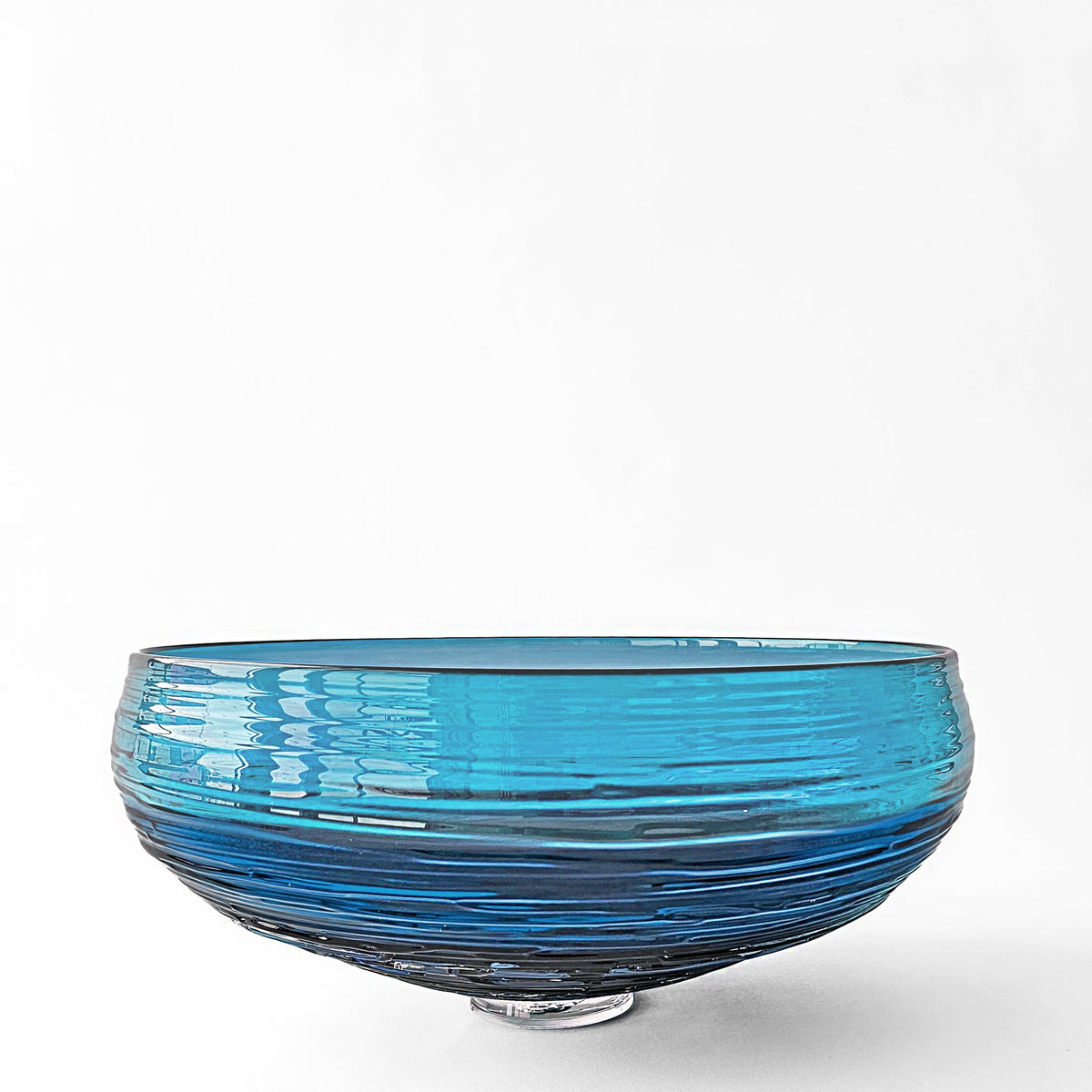 Blue Murano glass bowl on a white background